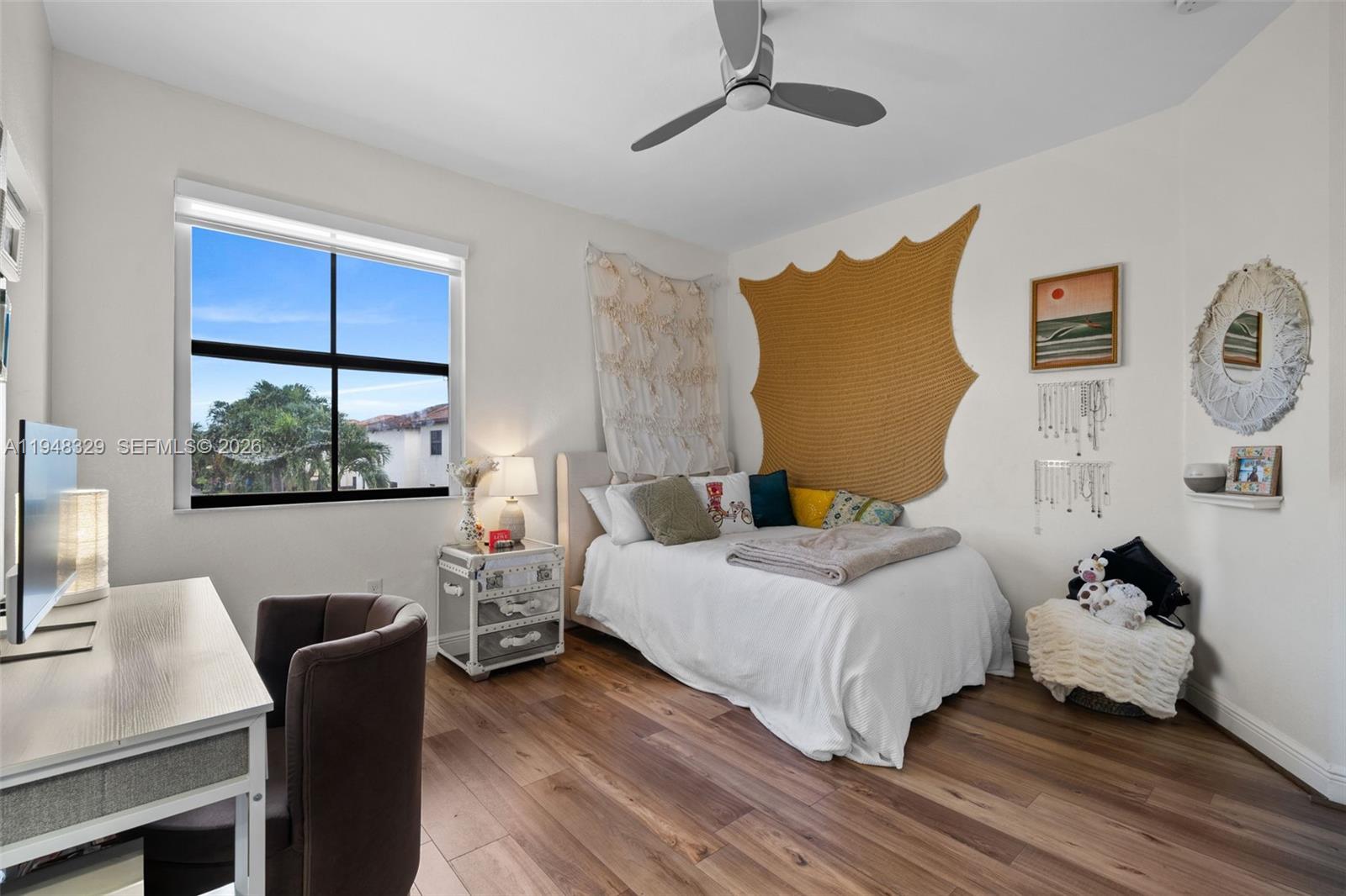 8658 Northwest 99th Path Doral, FL 33178 - Photo 12 of 46 a bedroom with a bed and wooden floor