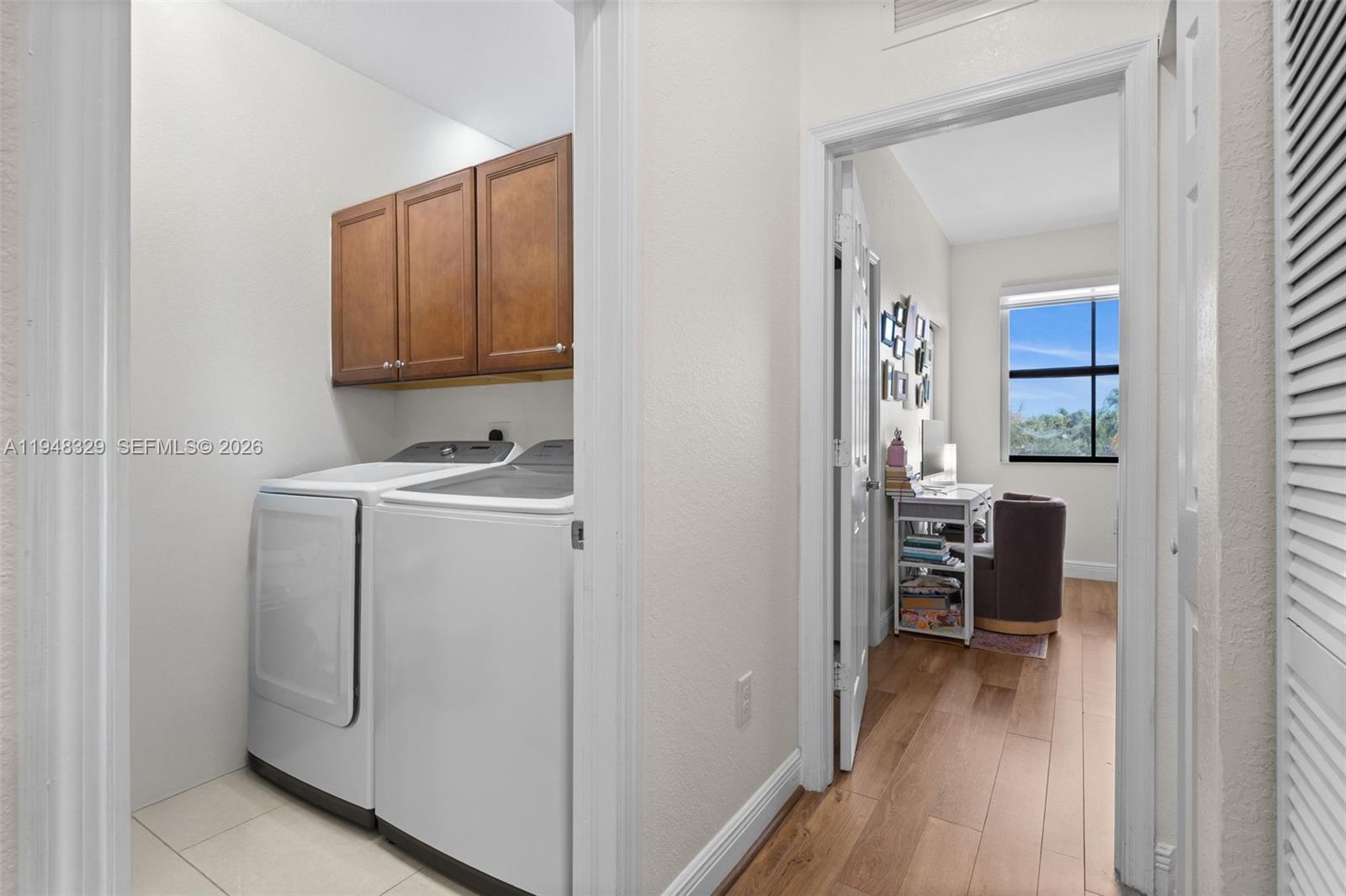 8658 Northwest 99th Path Doral, FL 33178 - Photo 15 of 46 a view of kitchen with furniture and wooden floor
