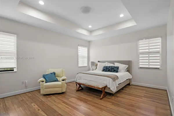 a bedroom with a bed and a couch