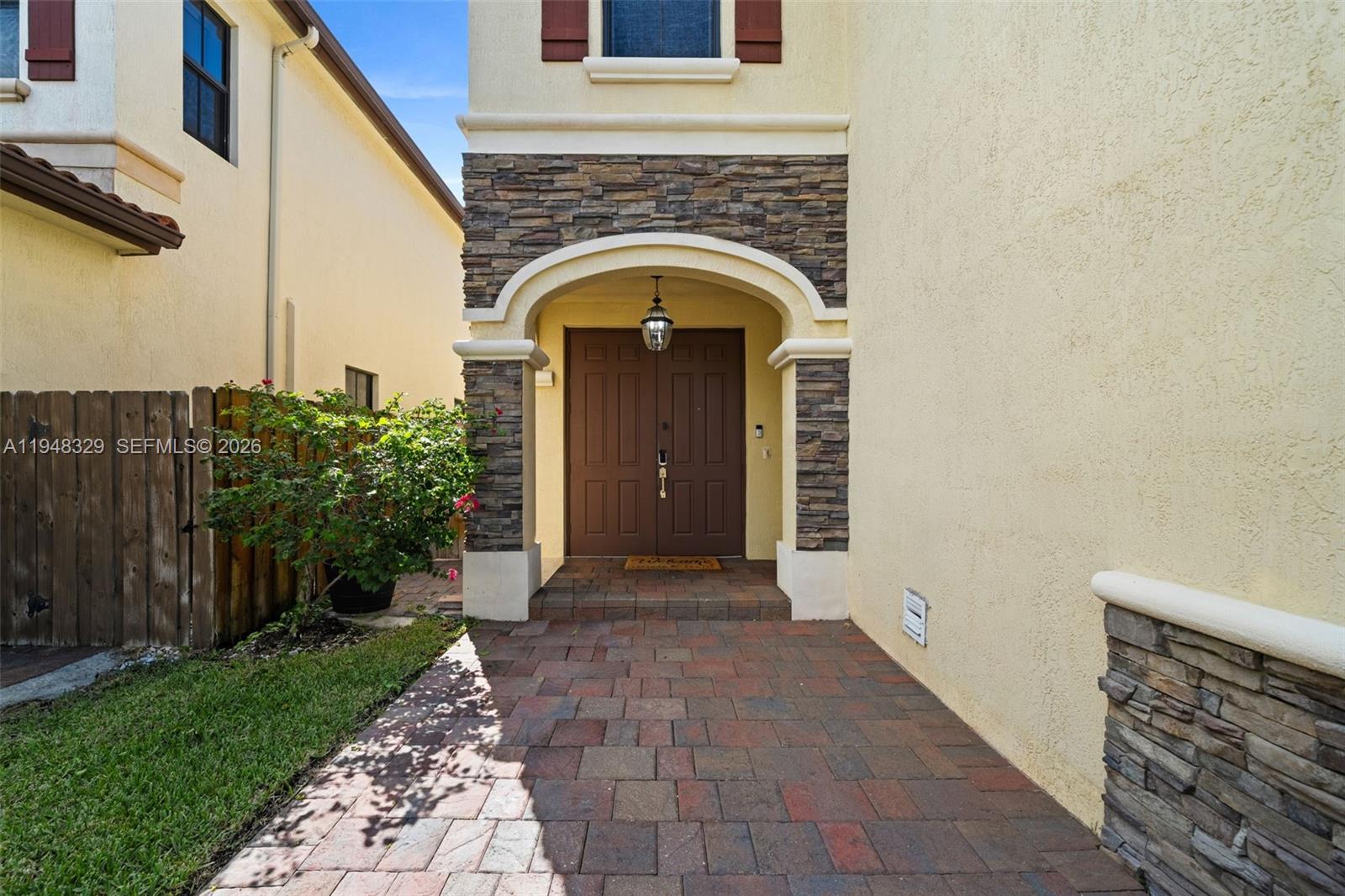 8658 Northwest 99th Path Doral, FL 33178 - Photo 2 of 46 a view of entrance door of the house