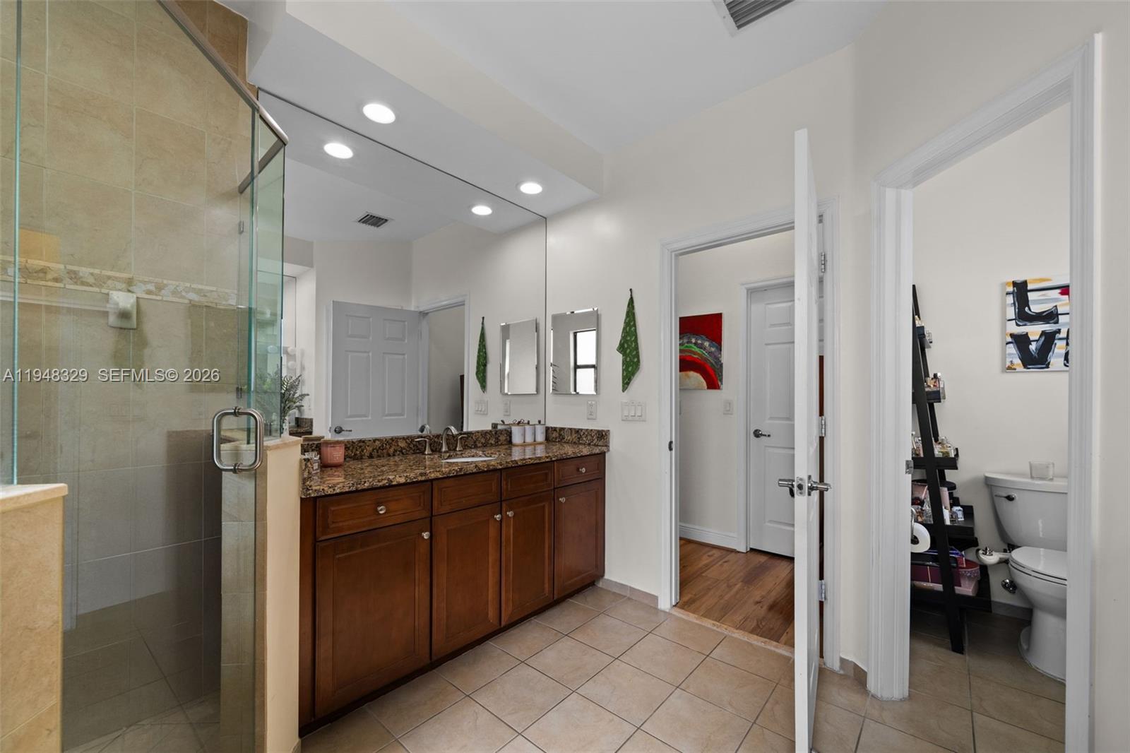 8658 Northwest 99th Path Doral, FL 33178 - Photo 24 of 46 a bathroom with a sink and a mirror