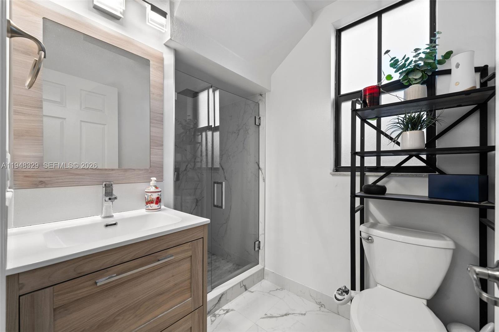 8658 Northwest 99th Path Doral, FL 33178 - Photo 25 of 46 a bathroom with a sink toilet and shower