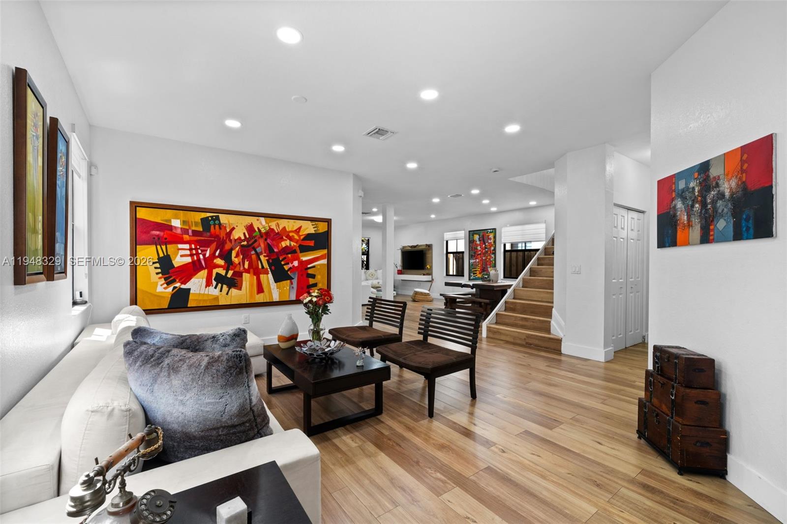 8658 Northwest 99th Path Doral, FL 33178 - Photo 29 of 46 a room with furniture projector and screen