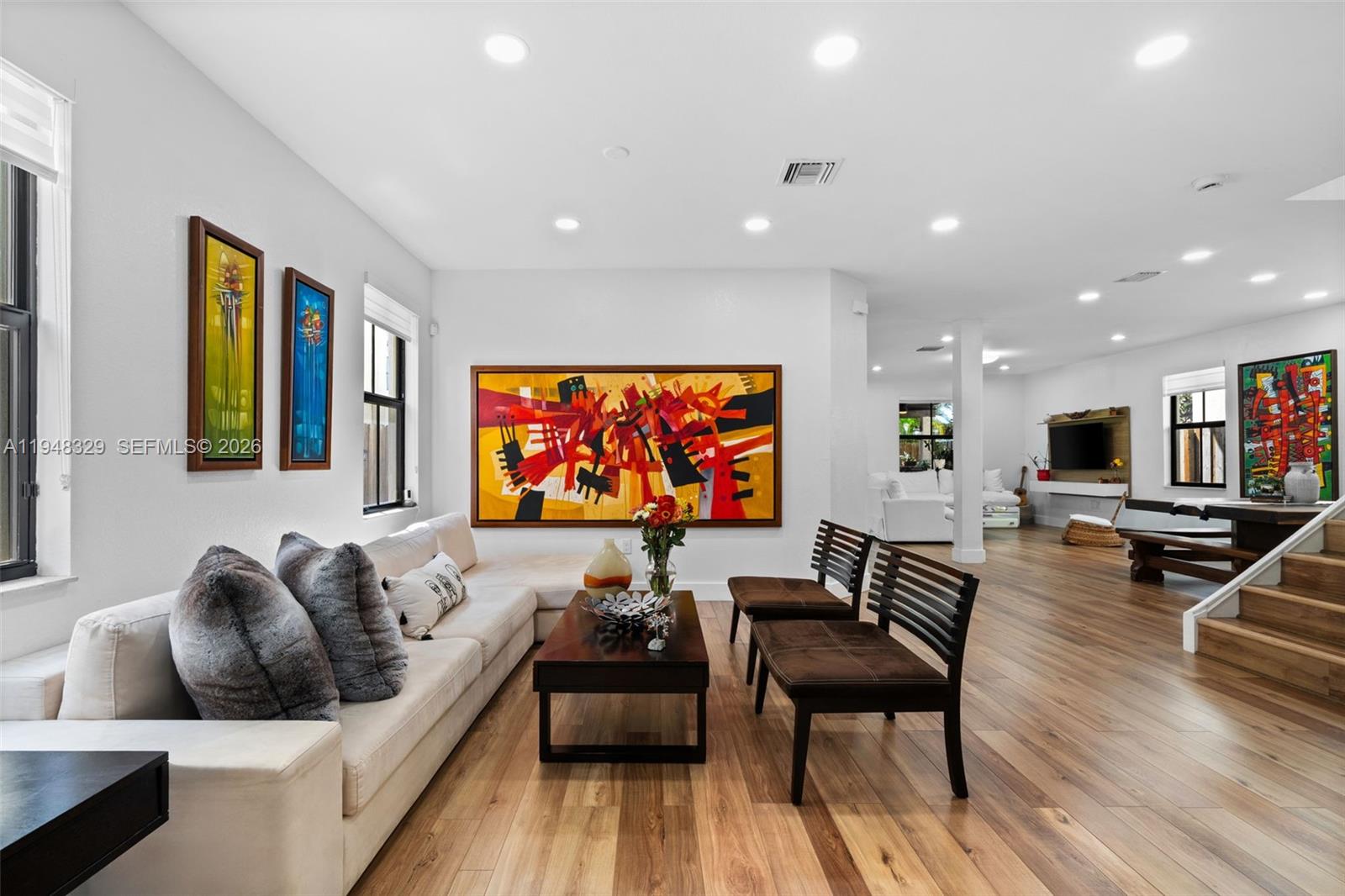 8658 Northwest 99th Path Doral, FL 33178 - Photo 30 of 46 a living room with furniture and a flat screen tv