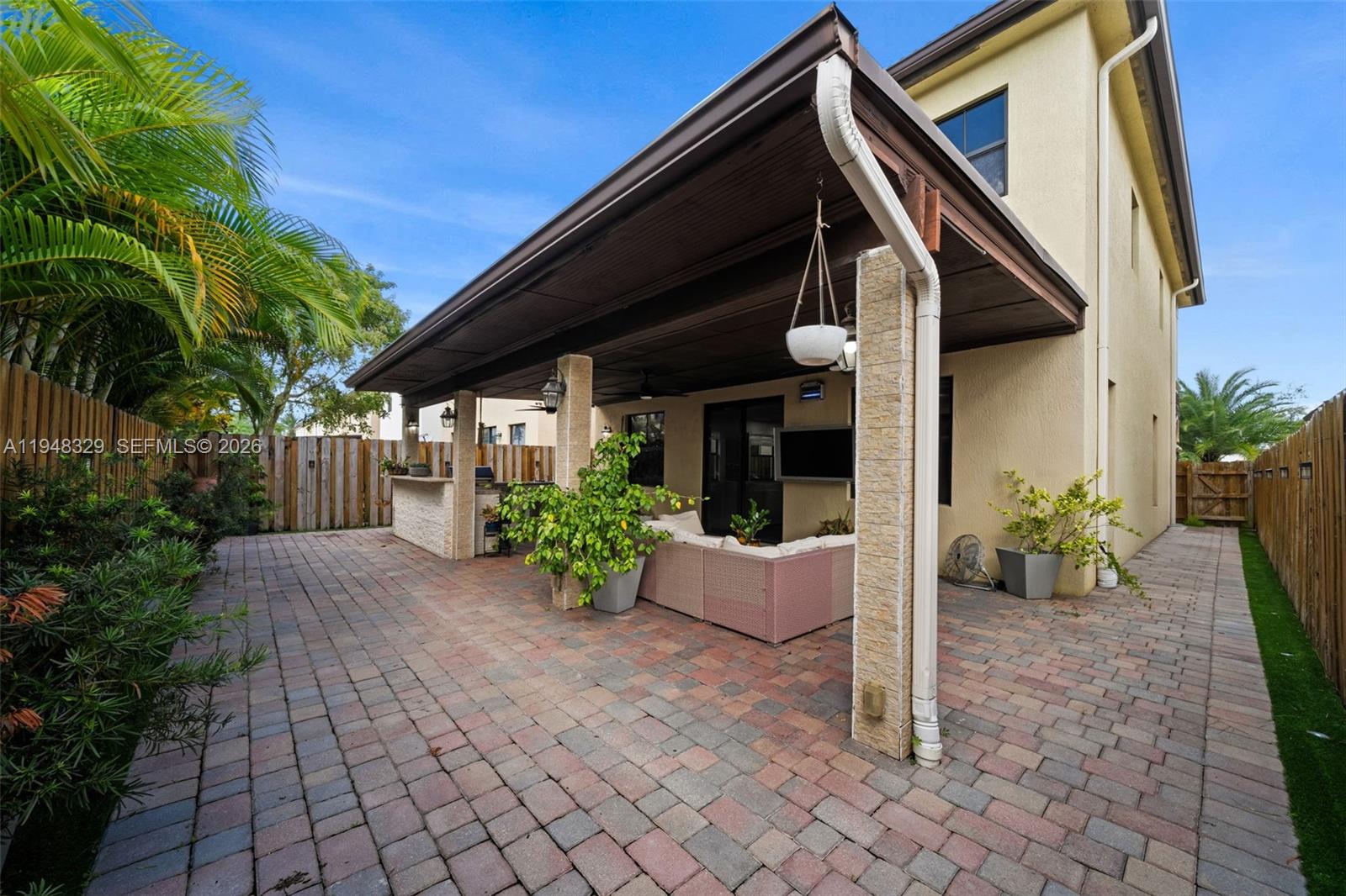 8658 Northwest 99th Path Doral, FL 33178 - Photo 3 of 46 a front view of a house having yard