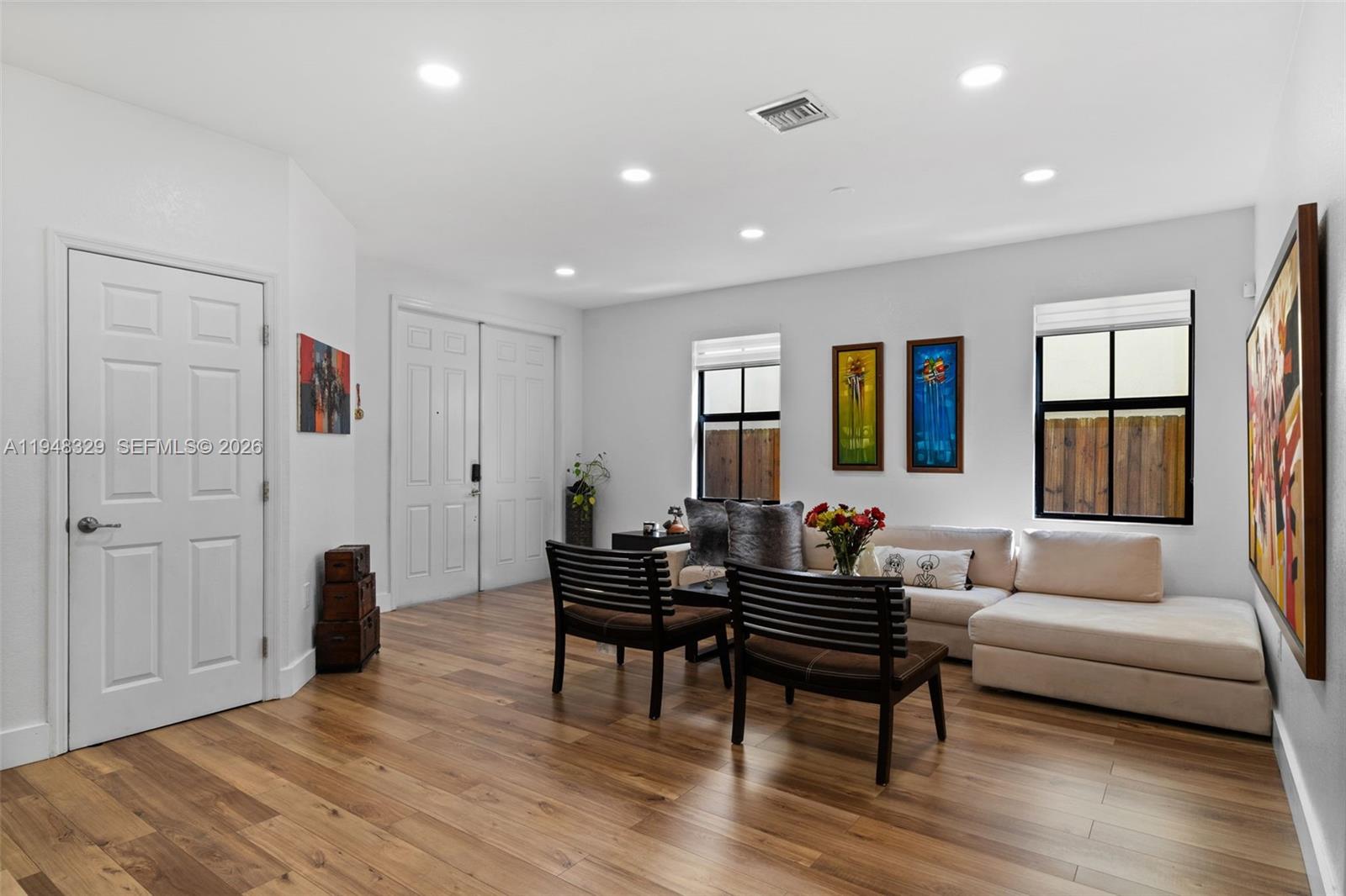 8658 Northwest 99th Path Doral, FL 33178 - Photo 31 of 46 a living room with furniture and a wooden floor