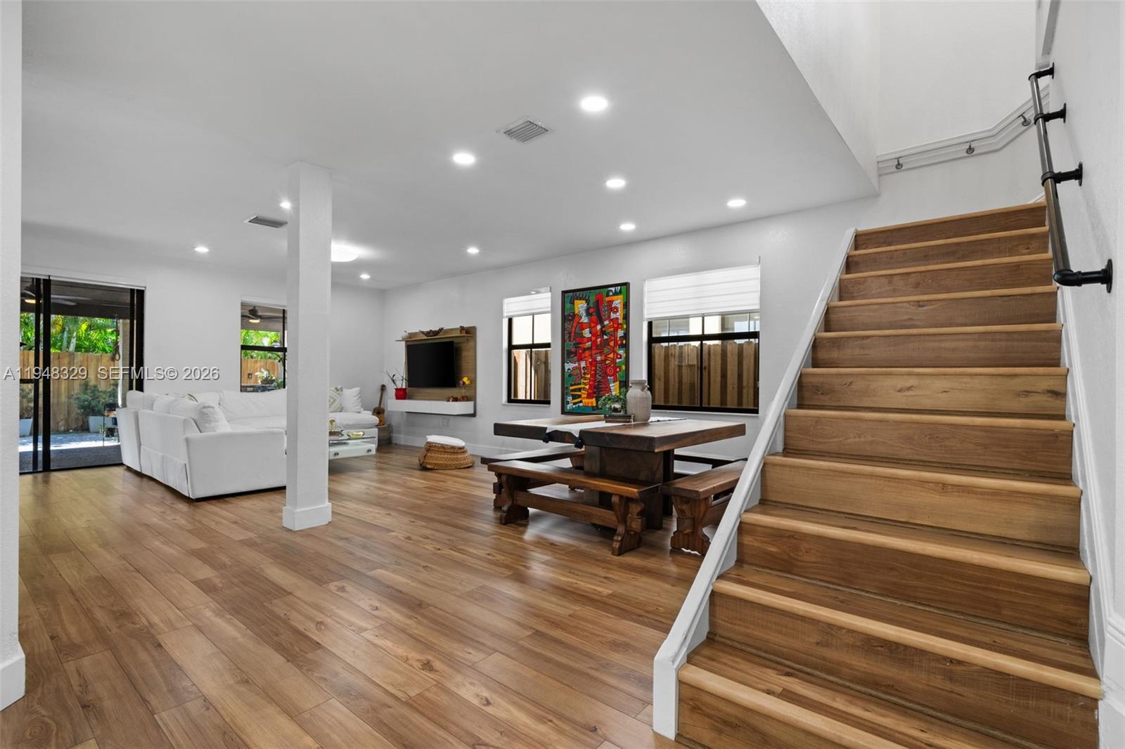 8658 Northwest 99th Path Doral, FL 33178 - Photo 32 of 46 a living room with furniture and a table