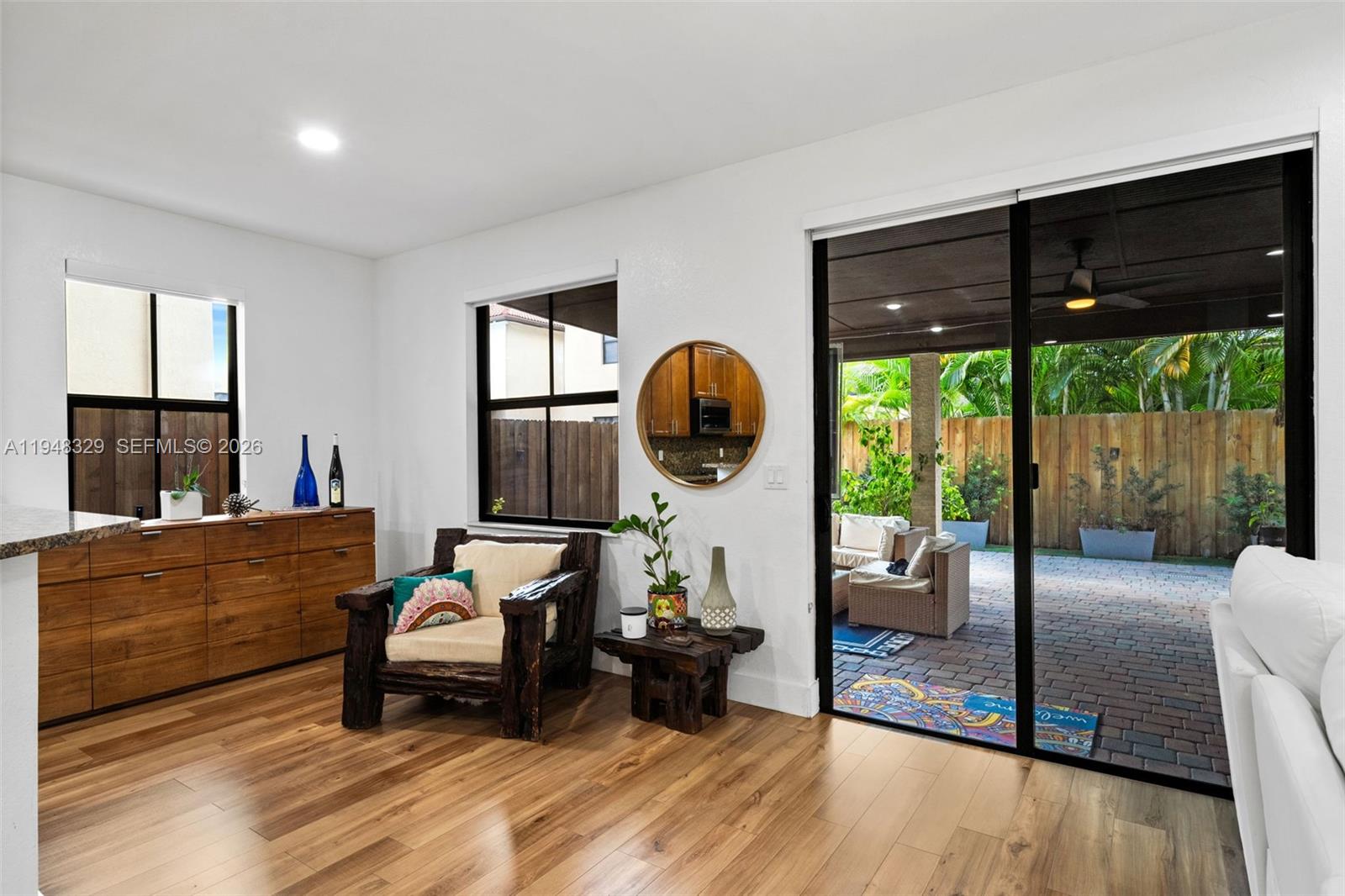 8658 Northwest 99th Path Doral, FL 33178 - Photo 46 of 46 a living room with furniture and a floor to ceiling window