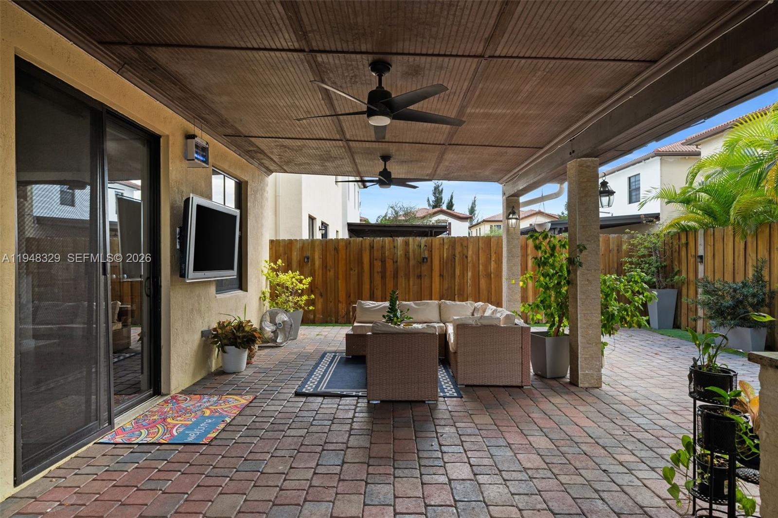 8658 Northwest 99th Path Doral, FL 33178 - Photo 6 of 46 a outdoor space with the couches and dining table with the balcony
