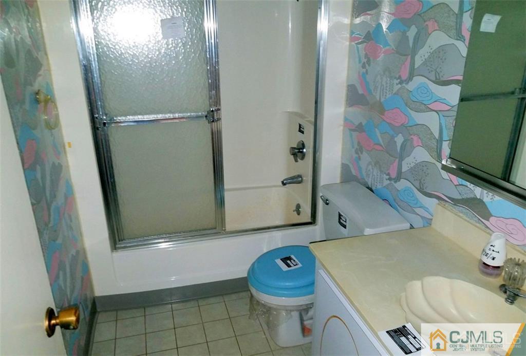40 C Haddon Road Monroe Township, NJ 08831 - Photo 7 of 12 a bathroom with a sink toilet and shower