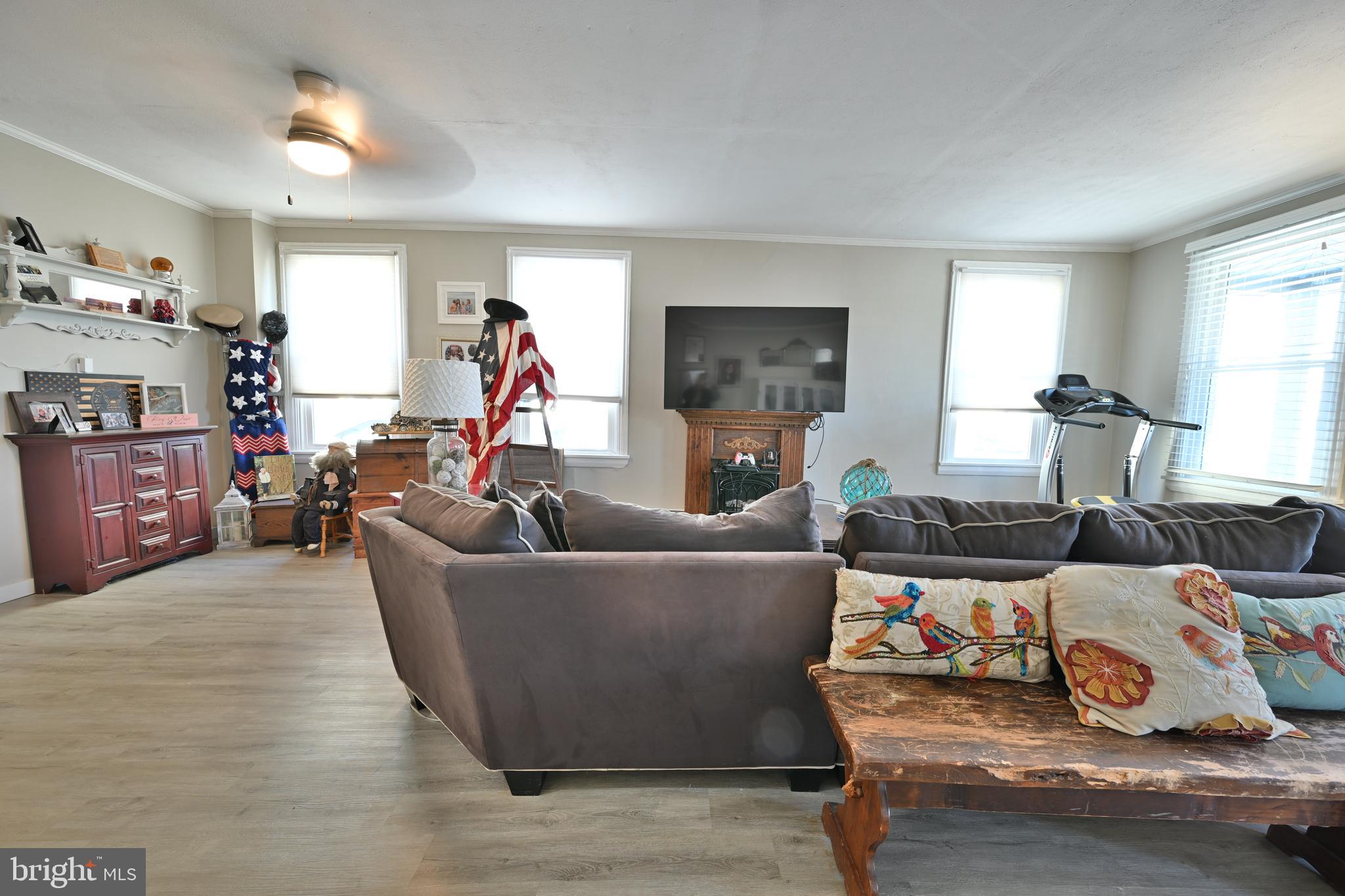 24734 East Main Street Columbus, NJ 08022 - Photo 7 of 24 a living room with furniture and a flat screen tv