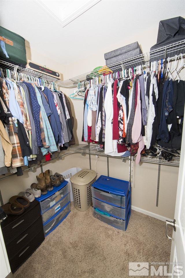 10898 Oakhaven Drive Reno, NV 89521 - Photo 13 of 19 a view of walk in closet with clothes and shoes