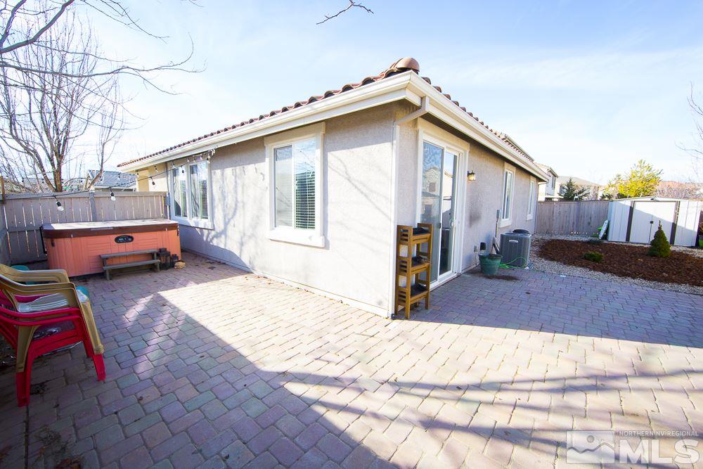 10898 Oakhaven Drive Reno, NV 89521 - Photo 19 of 19 a house view with a backyard space