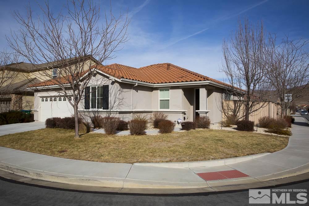 10898 Oakhaven Drive Reno, NV 89521 - Photo 3 of 19 a front view of a house with garden