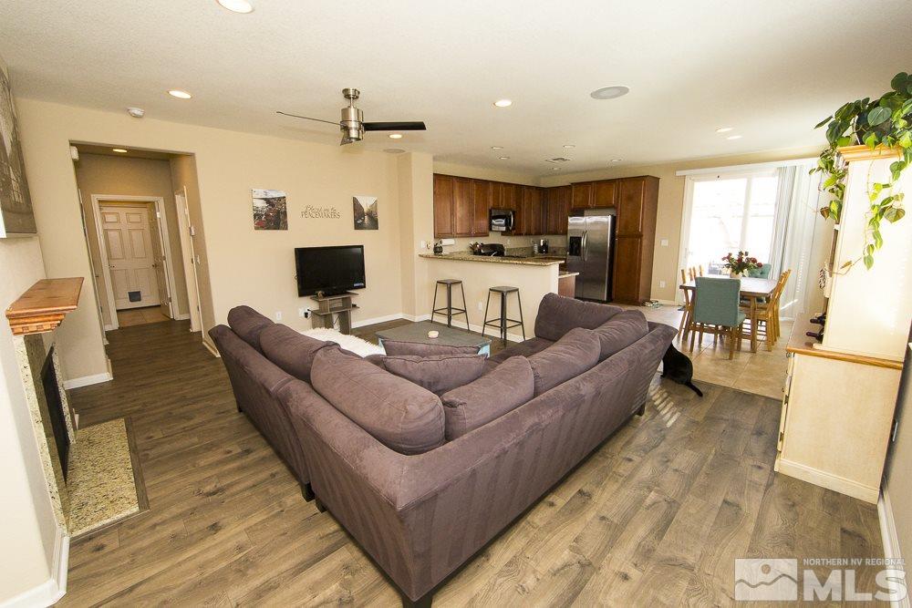 10898 Oakhaven Drive Reno, NV 89521 - Photo 6 of 19 a living room with furniture and a flat screen tv