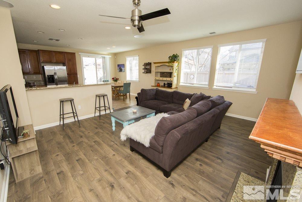 10898 Oakhaven Drive Reno, NV 89521 - Photo 7 of 19 a living room with furniture and a flat screen tv