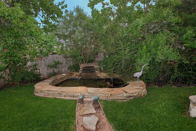 a view of a garden with a fountain