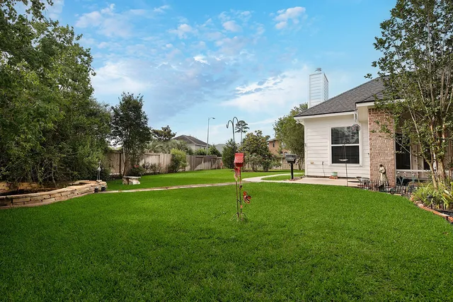 a view of a house with a backyard