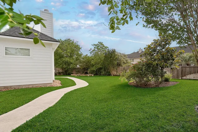 a view of a garden with a house