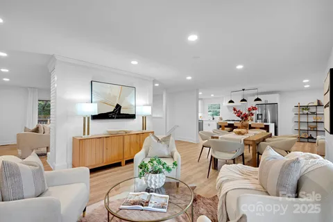 a living room with furniture kitchen and a kitchen view