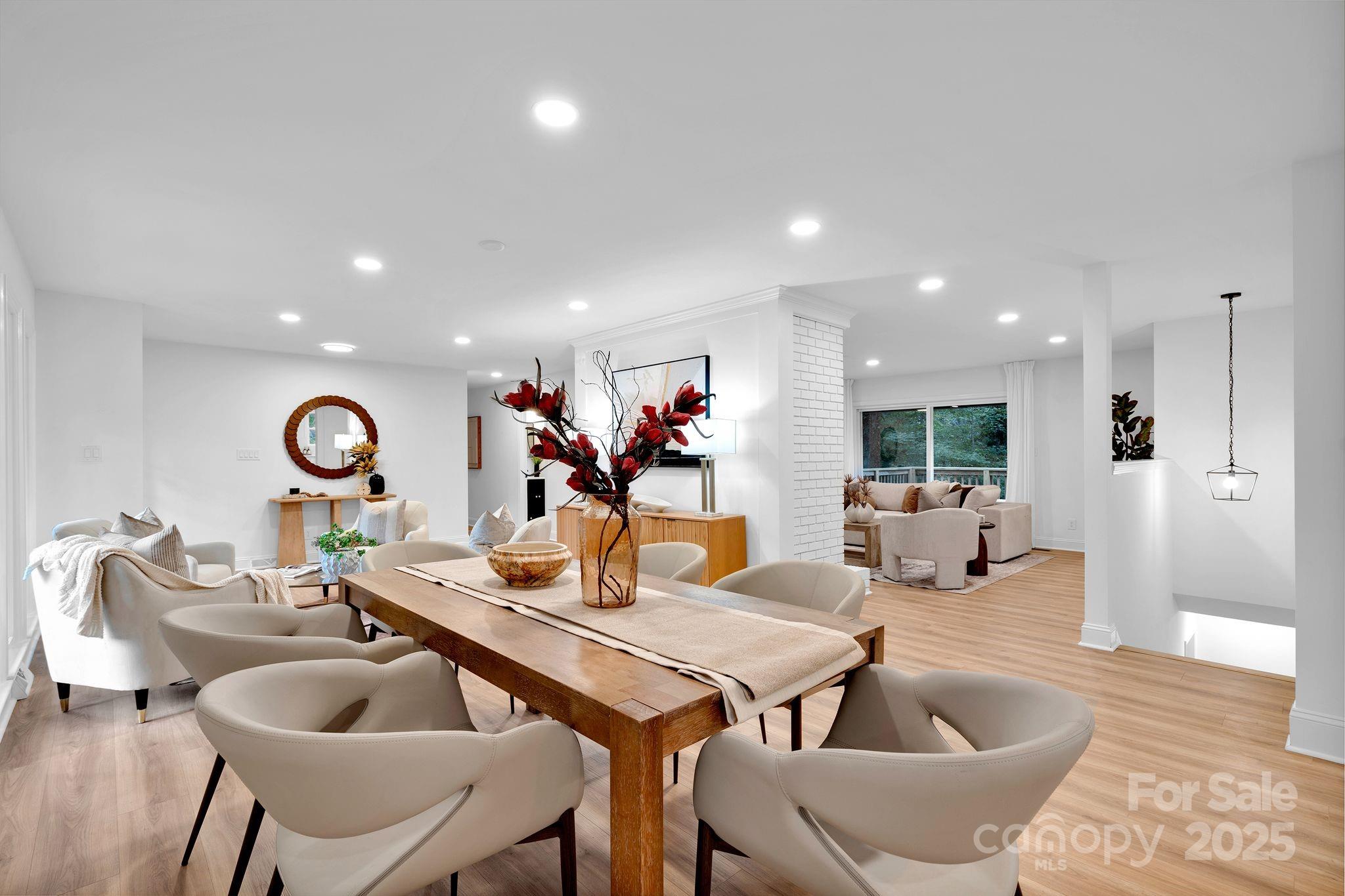 3200 Highview Road Charlotte, NC 28210 - Photo 12 of 48 a living room with furniture and a dining table with wooden floor