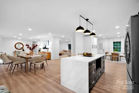a view of kitchen with dining table and chairs