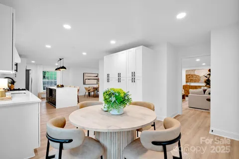 a kitchen with a table and chairs in it