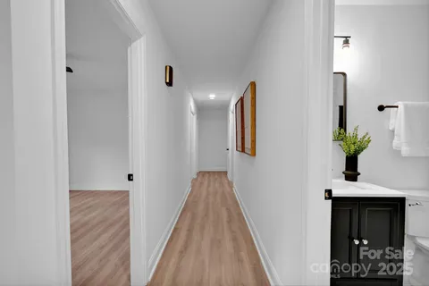 a spacious bedroom with a bed and ceiling fan