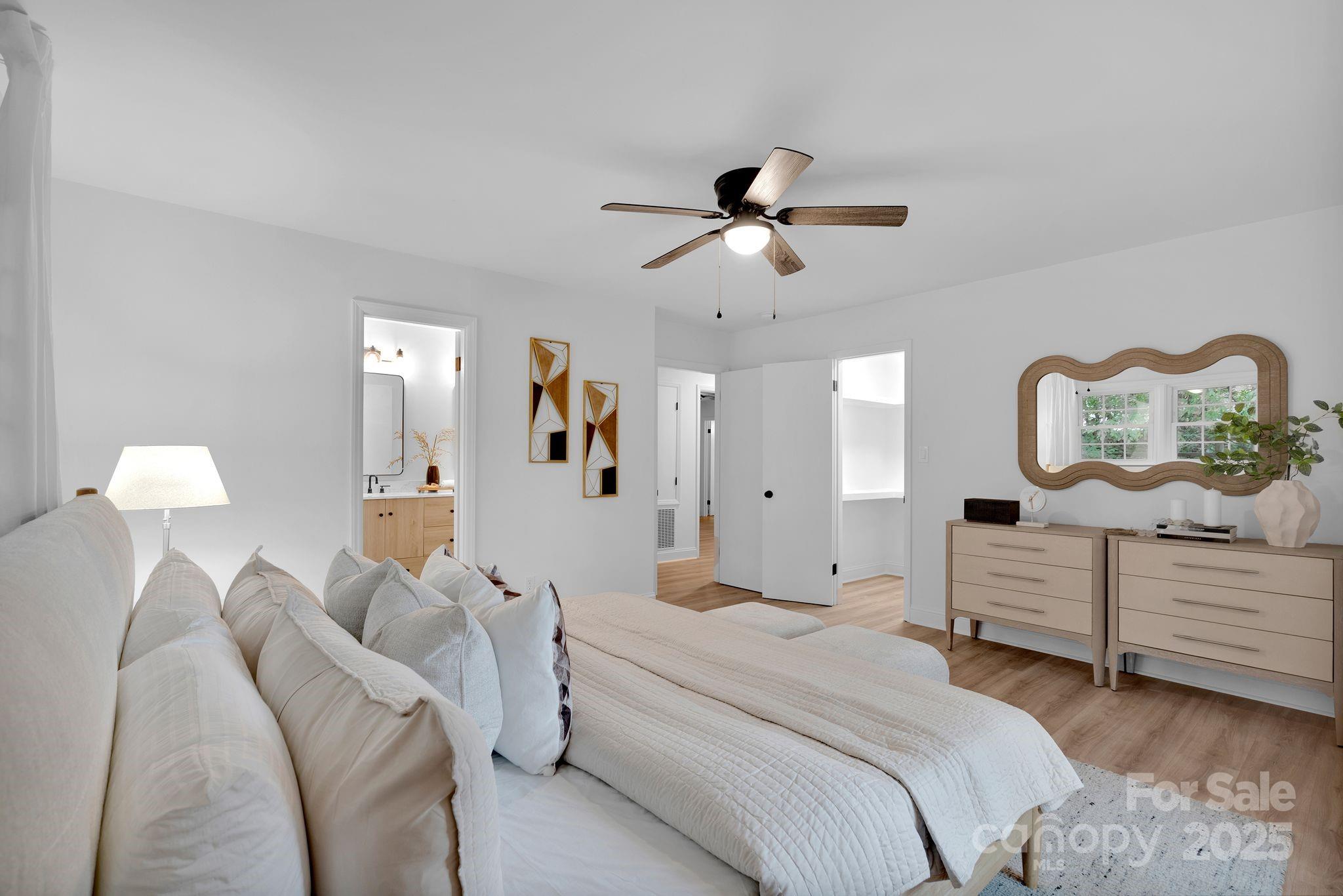3200 Highview Road Charlotte, NC 28210 - Photo 22 of 48 a spacious bedroom with a bed and ceiling fan