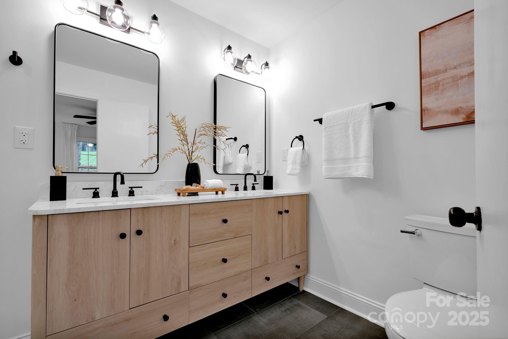 3200 Highview Road Charlotte, NC 28210 - Photo 23 of 48 a bathroom with a double vanity sink mirror and
