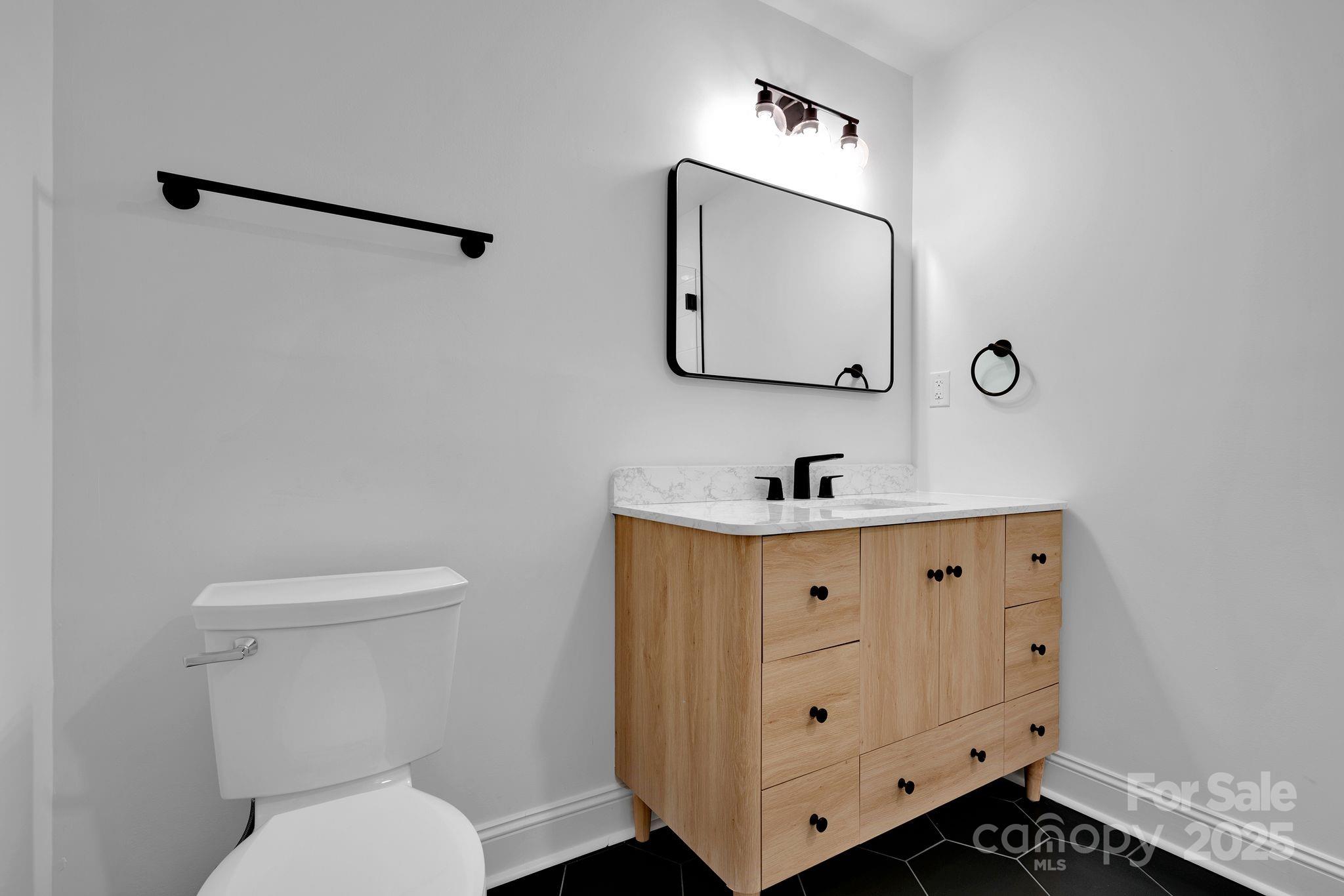 3200 Highview Road Charlotte, NC 28210 - Photo 27 of 48 a bathroom with a toilet sink and mirror