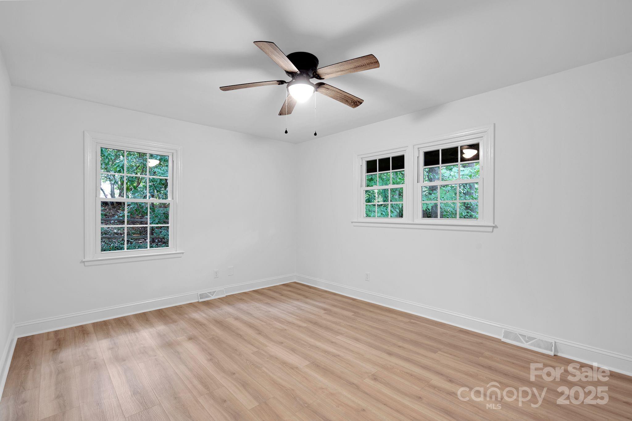 3200 Highview Road Charlotte, NC 28210 - Photo 29 of 48 a view of empty room with wooden floor and fan