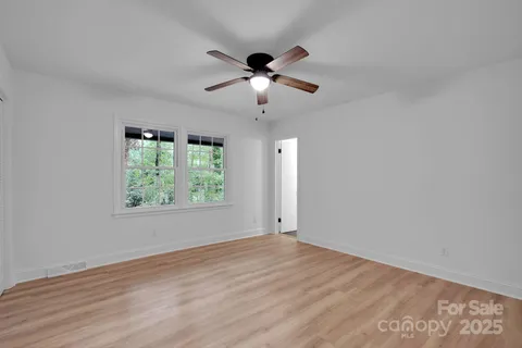a view of a livingroom with furniture and wooden floor