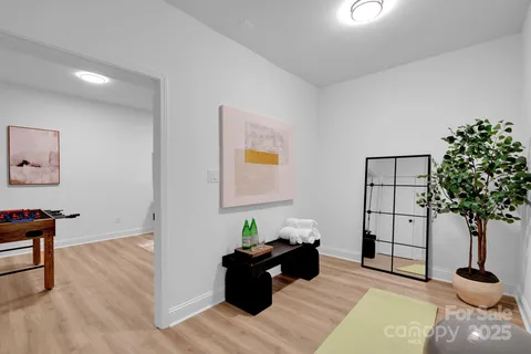 a view of a kitchen with wooden floor and staircase
