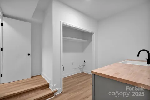 a view of a house with a tree