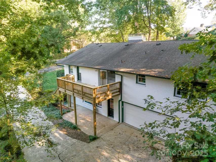 front view of a house with a tree