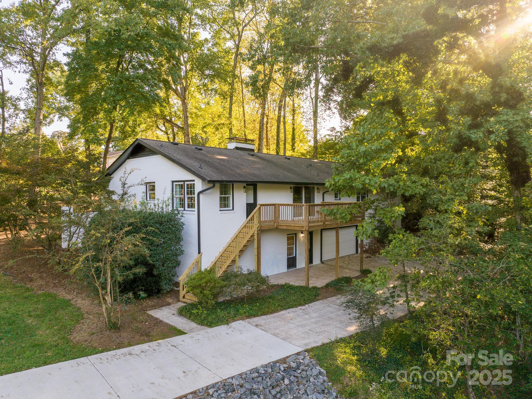 3200 Highview Road Charlotte, NC 28210 - Photo 46 of 48 a view of a house with a yard and potted plants