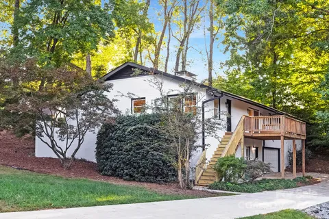 front view of a house with a tree