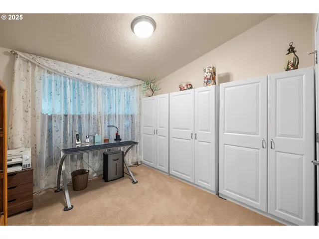 a kitchen with a refrigerator and a cabinets
