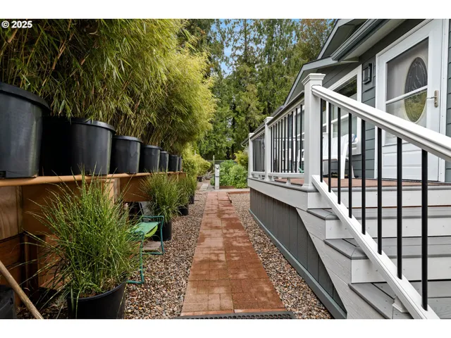 a view of a house with backyard and deck
