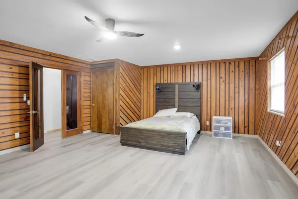 a view of room with stairs and wooden floor
