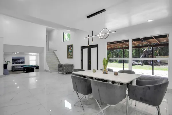 a bedroom with furniture and a flat screen tv