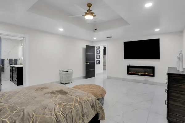 a bedroom with a bed and a dresser