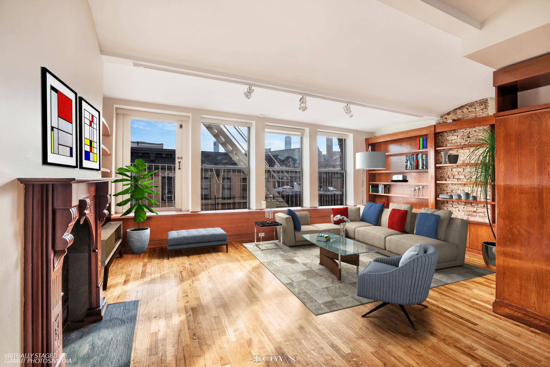115 Christopher Street, Unit 6 Manhattan, NY 10014 - Photo 1 of 12 a living room with furniture and a floor to ceiling window