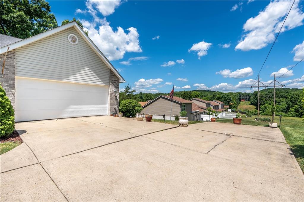228 Country View Drive Lower Burrell, PA 15068 - Photo 42 of 49 a view of a house with a patio