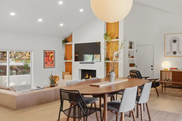 a view of a dining room with furniture window and wooden floor