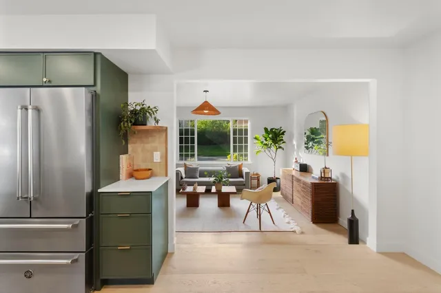 a kitchen with a sink a stove and cabinets
