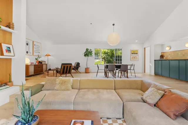 a bathroom with double vanity sinks and a mirror