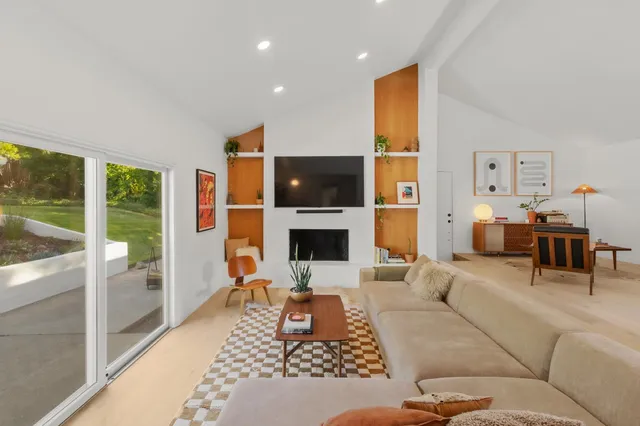 a bedroom with a bed and lamp