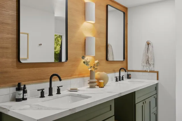 a room with furniture and painting on the wall